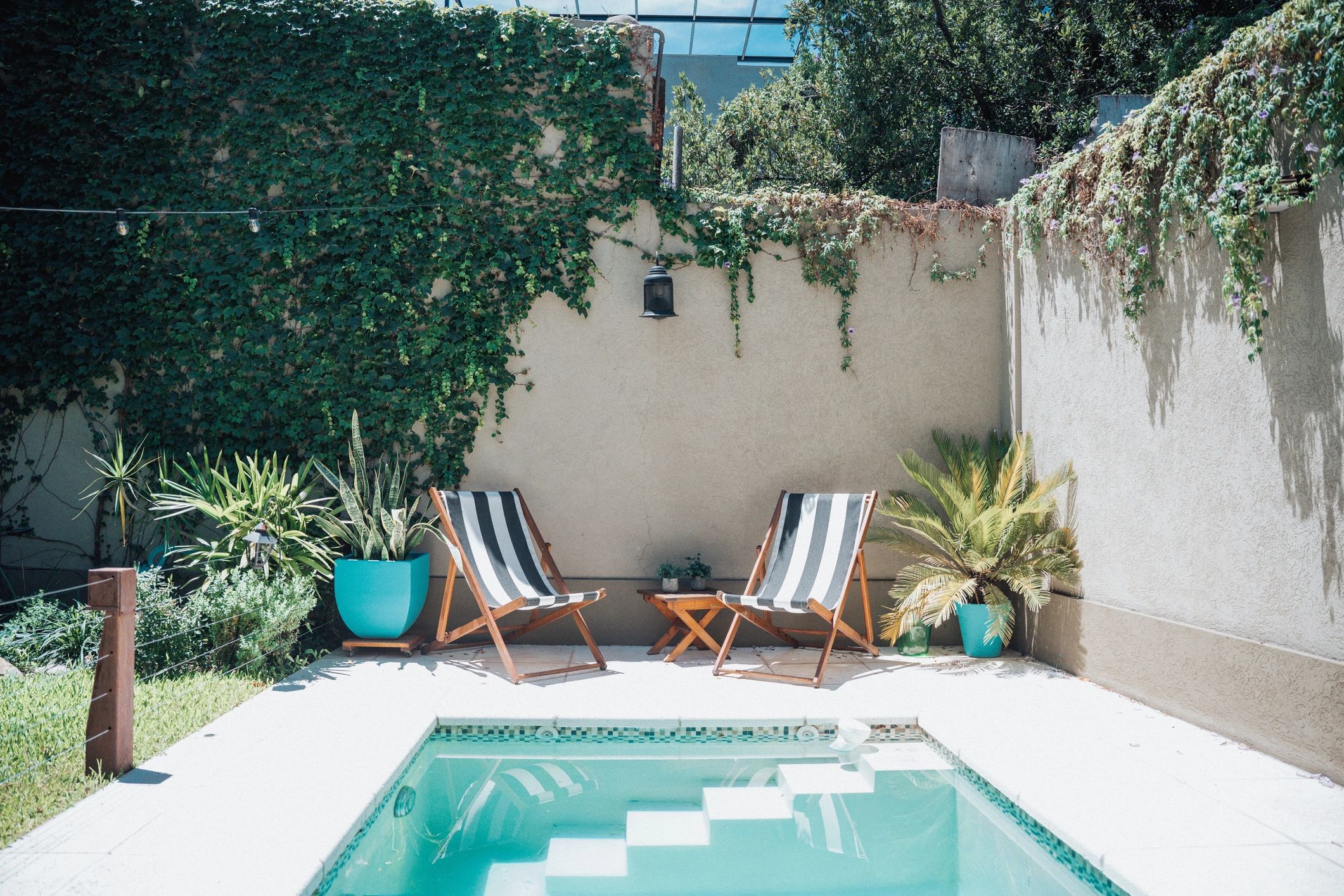 Clean residential pool with bright blue water ready for weekly maintenance